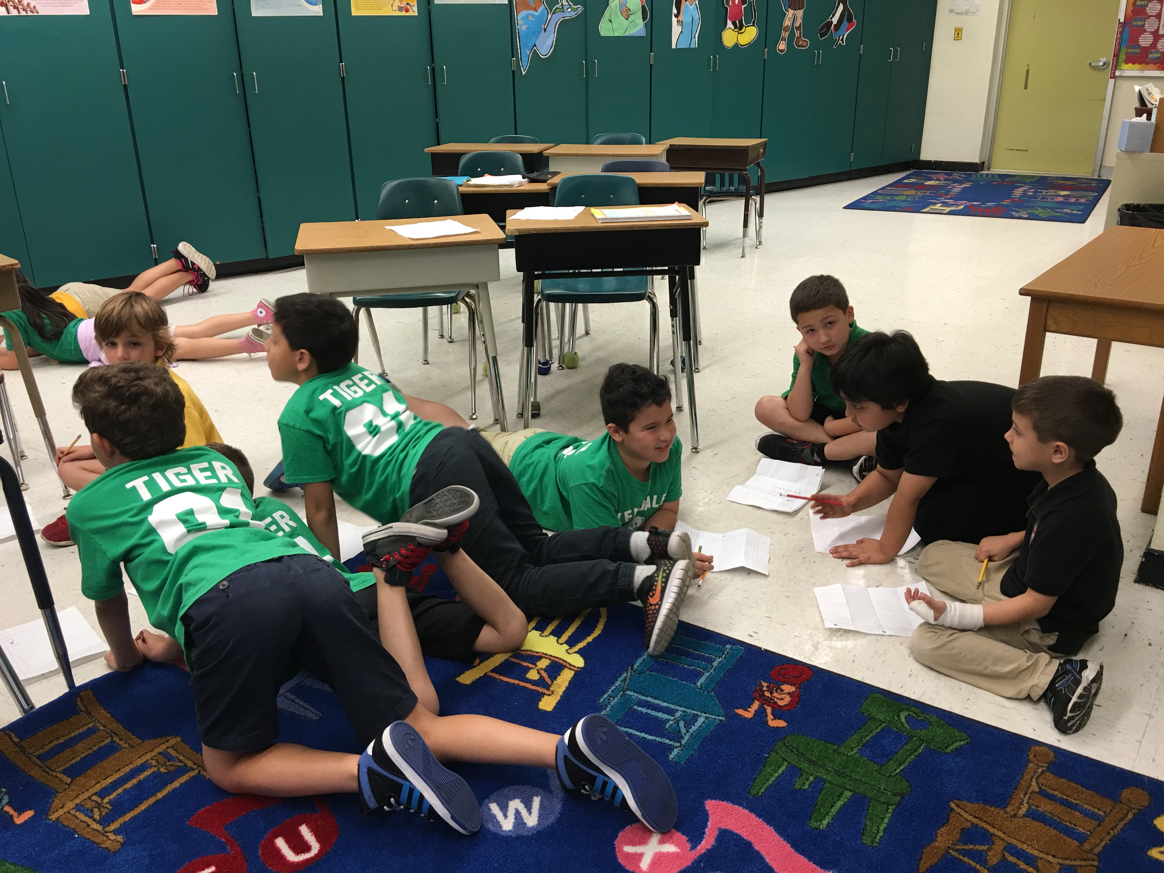An image of boys working on a group project