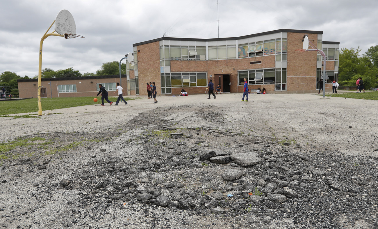 An image of school playground in a poor neighborhood